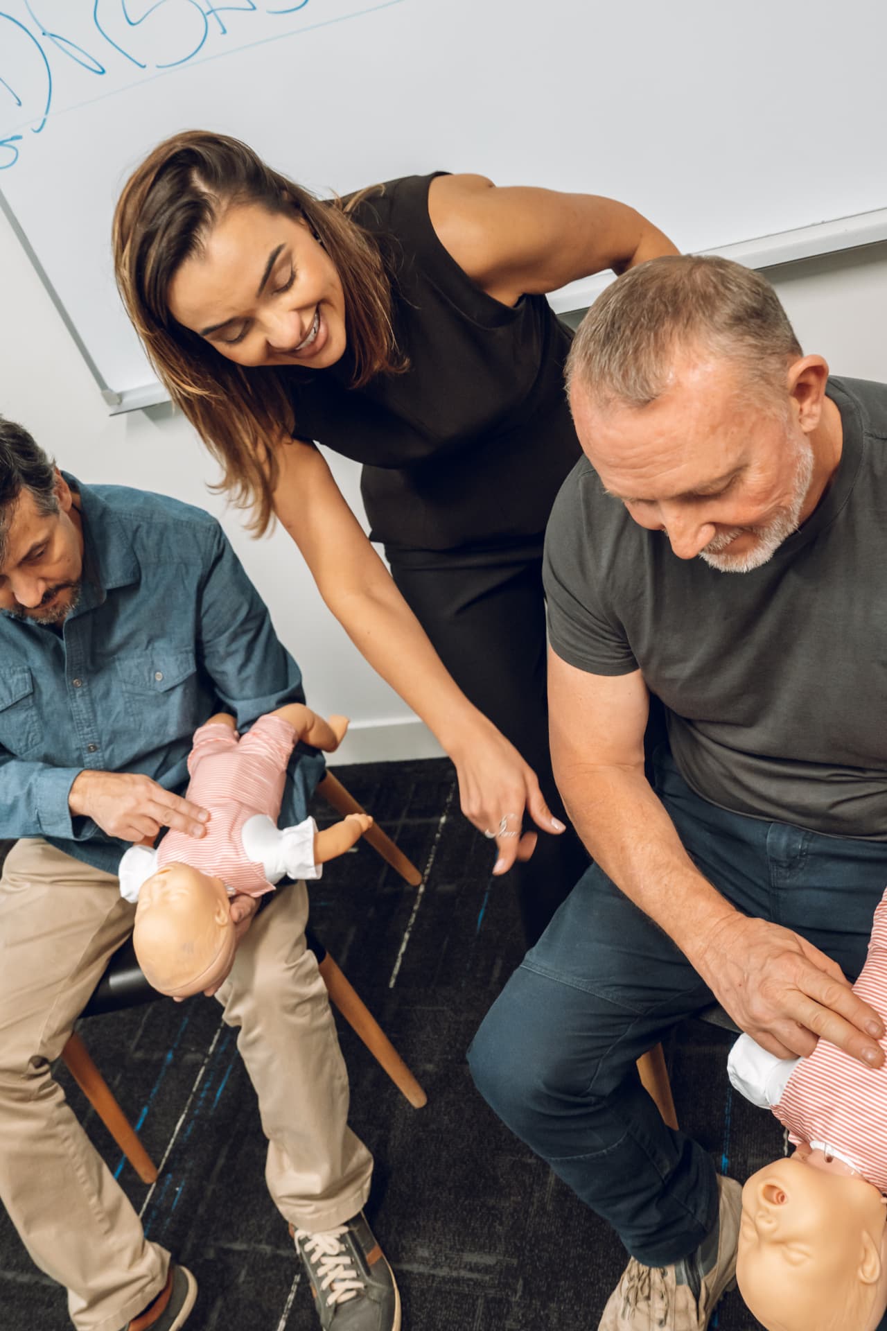Fab Ferreira guiding participants through infant CPR practice